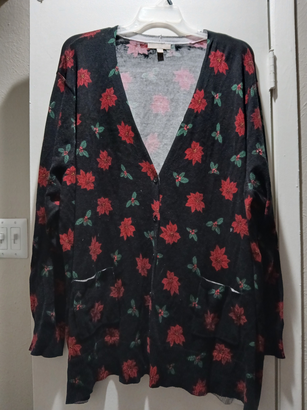 Woman Within Black Cardigan with Red Poinsettia Print